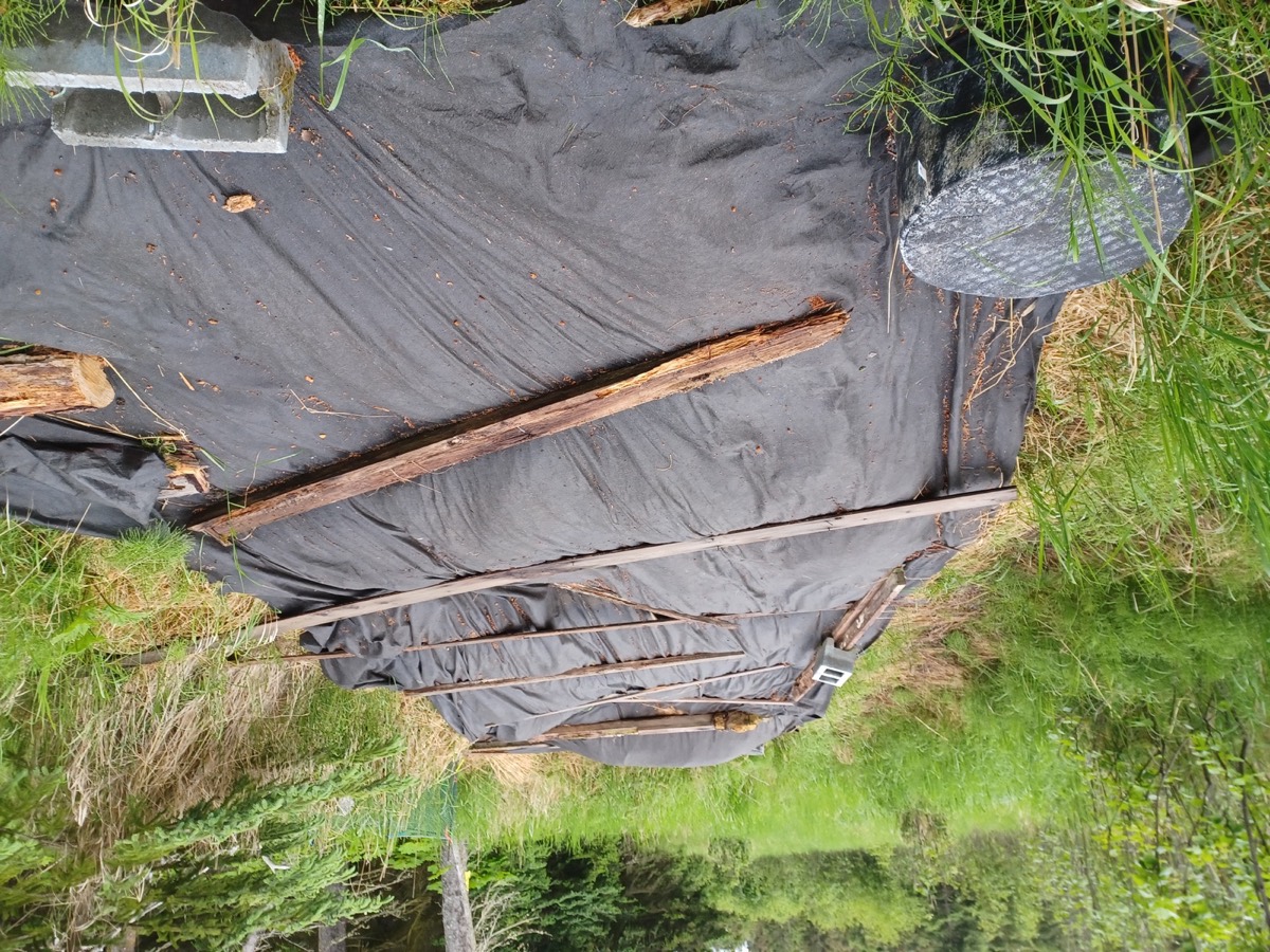 Landscape ground-cover fabric laid over an outdoor planting area
